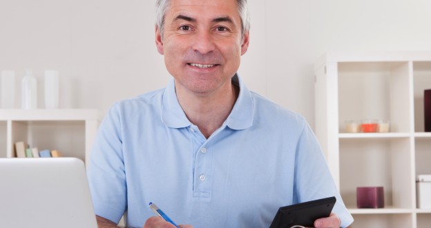 Happy Mature Man Calculating